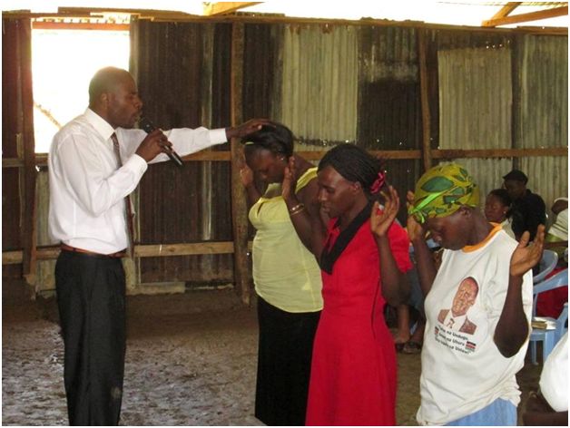 Image result for pastor in rural kenya praying